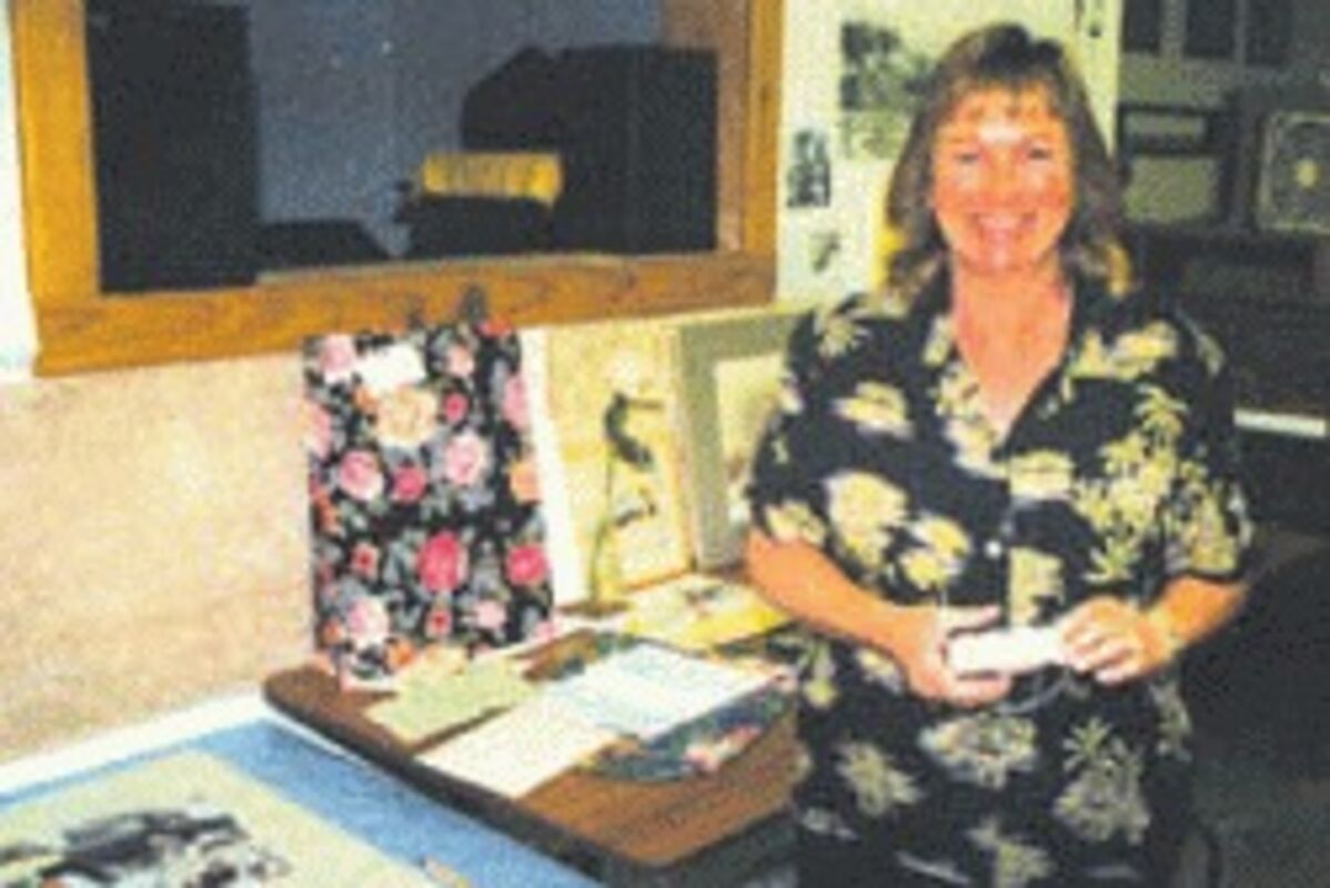 Darcey Stilwell in charge of Foster Post Office, celebrating 110th