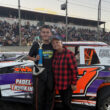 Street Stocks Trophy Dash winner Danner Myers (left) celebrates with honorary trophy girl Denise Estep (right), who returned to present trophies after once serving as a Willamette Speedway trophy girl years ago.