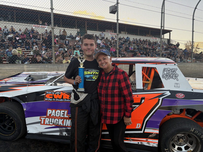 Street Stocks Trophy Dash winner Danner Myers (left) celebrates with honorary trophy girl Denise Estep (right), who returned to present trophies after once serving as a Willamette Speedway trophy girl years ago.